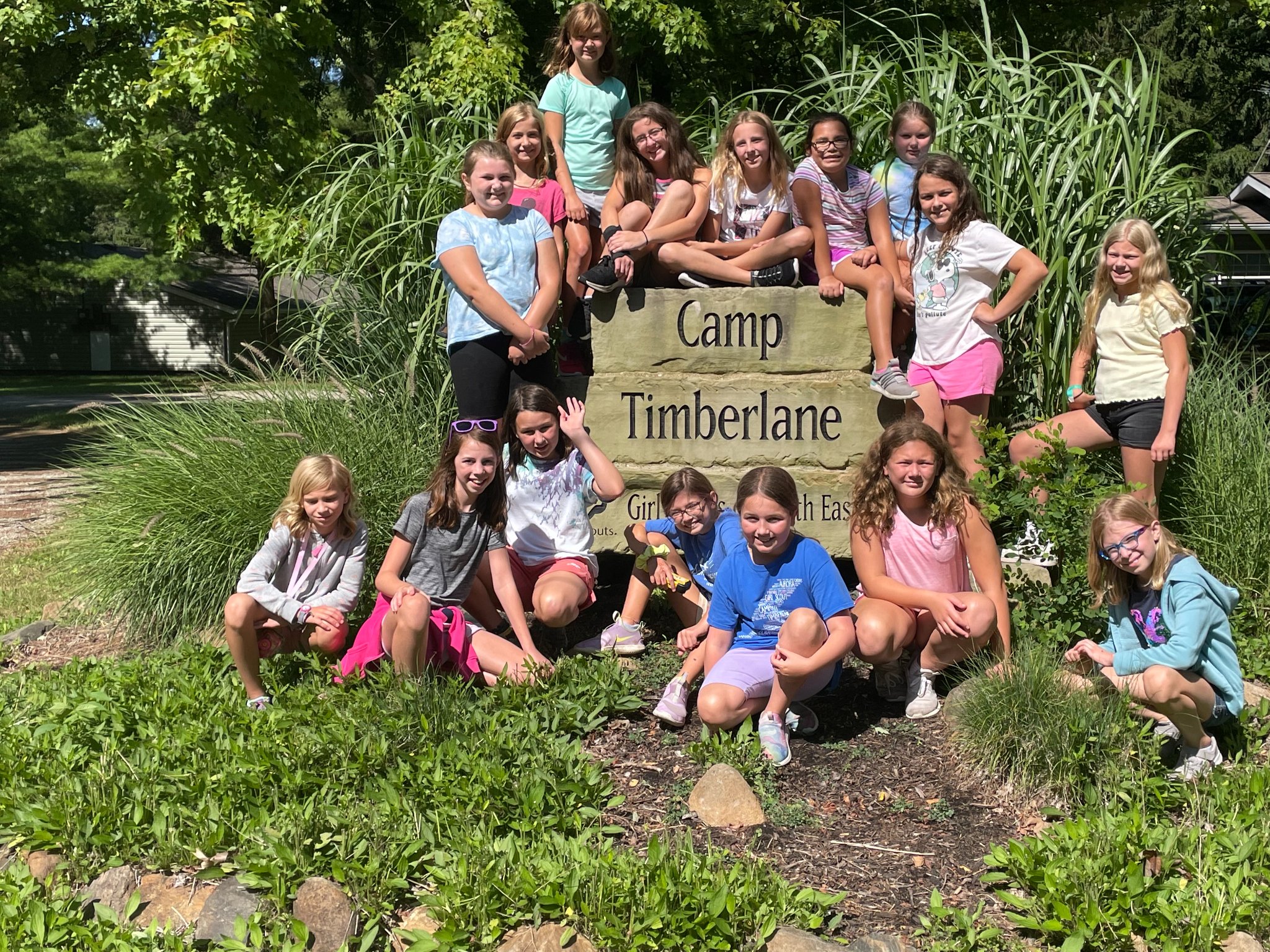 Brick pavers at Camp Timberlane with girls around the Camp Timberlane sign