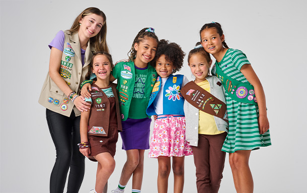 Six Girl Scouts of various ages standing together